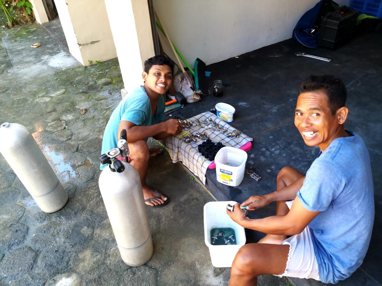 Angga and Komang keeping themselves busy servicing tanks